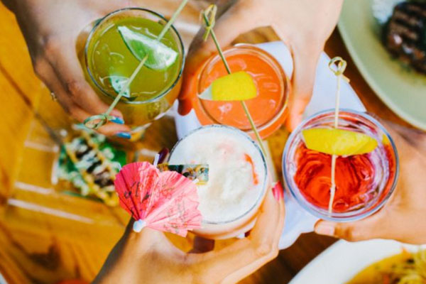 Friends toasting cocktails