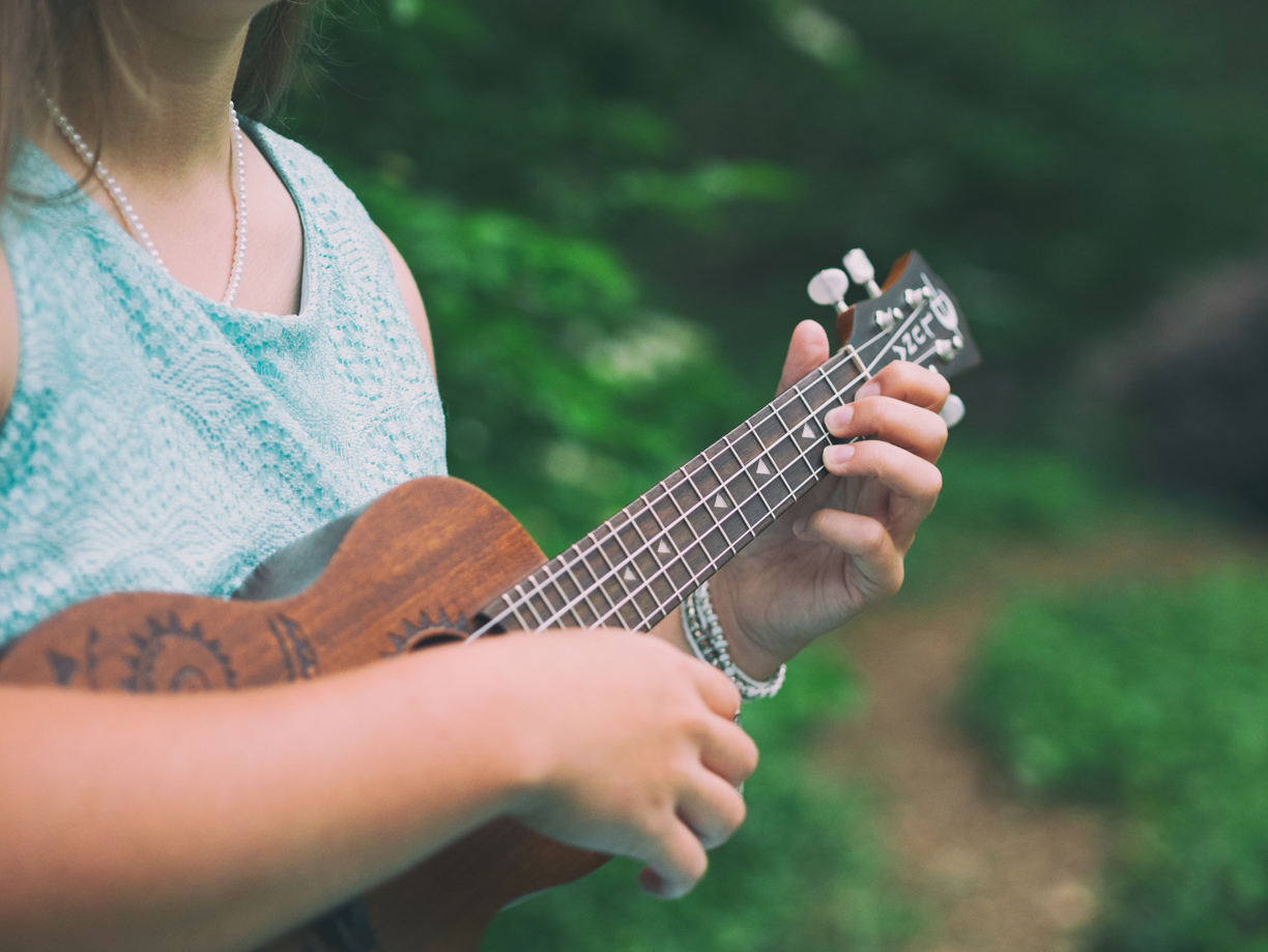 woman playing ukulele